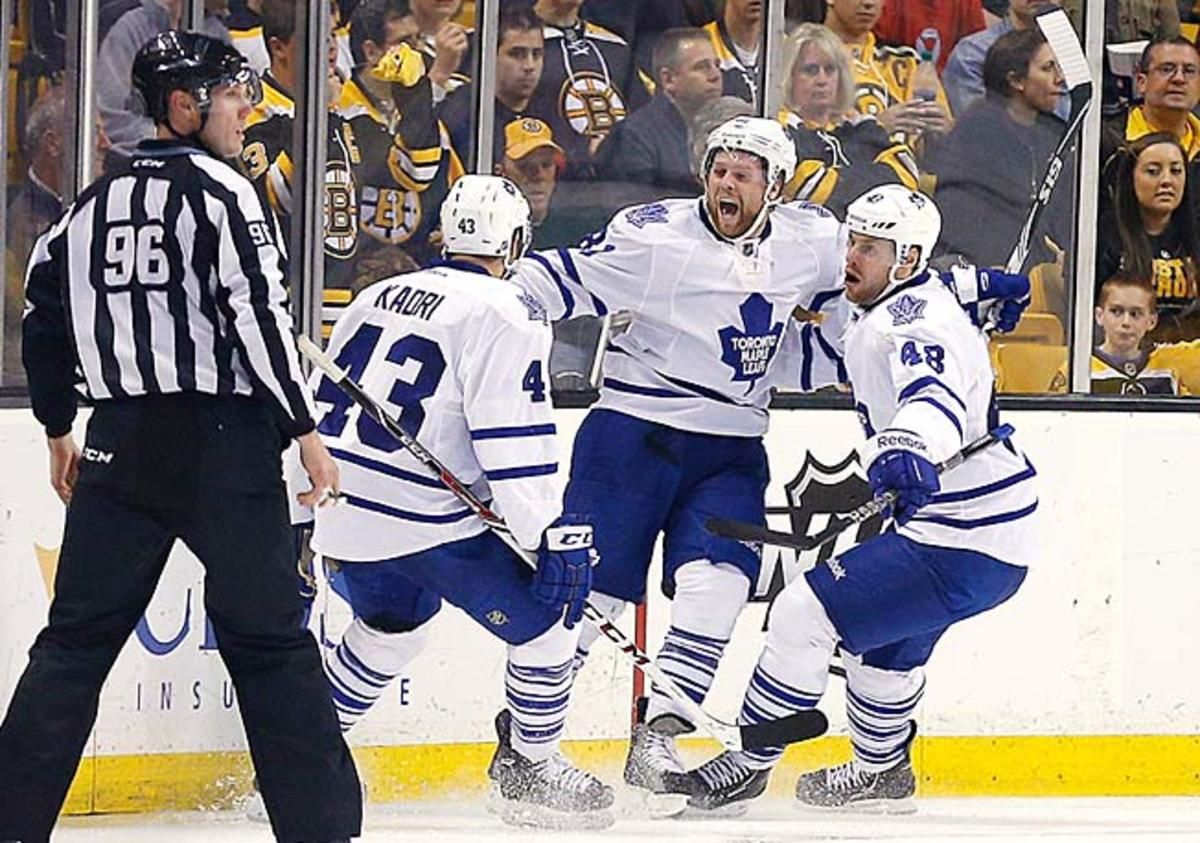 Phil Kessel (center) returned to Boston amid scowls, but finally had a reason to smile in Game 2.