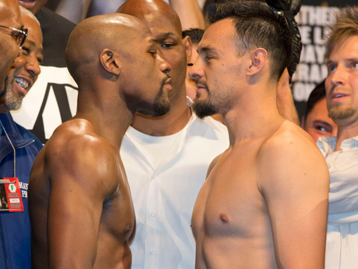 Floyd Mayweather, Jr., and Robert Guerrero each made weight for their upcoming bout. (Julie Jacobson/AP)