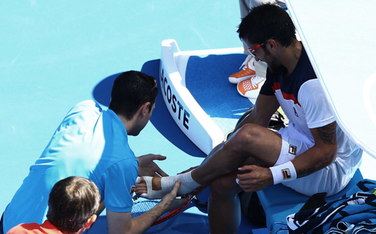 Janko Tipsarevic received treatment on his injured foot injury and called it quits when trailing 6-2, 5-1.