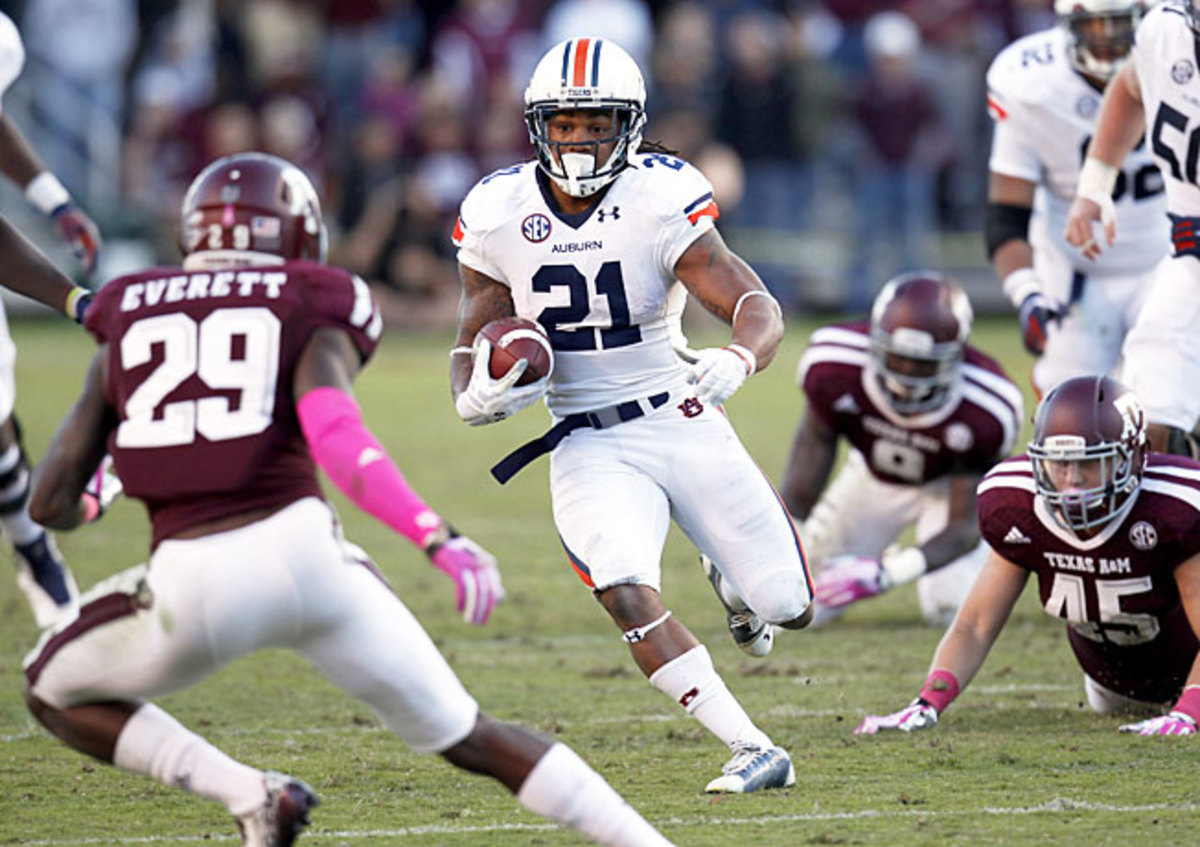 Tre Mason (21) rushed for 178 yards and a score in Auburn's upset victory over Texas A&M at Kyle Field.