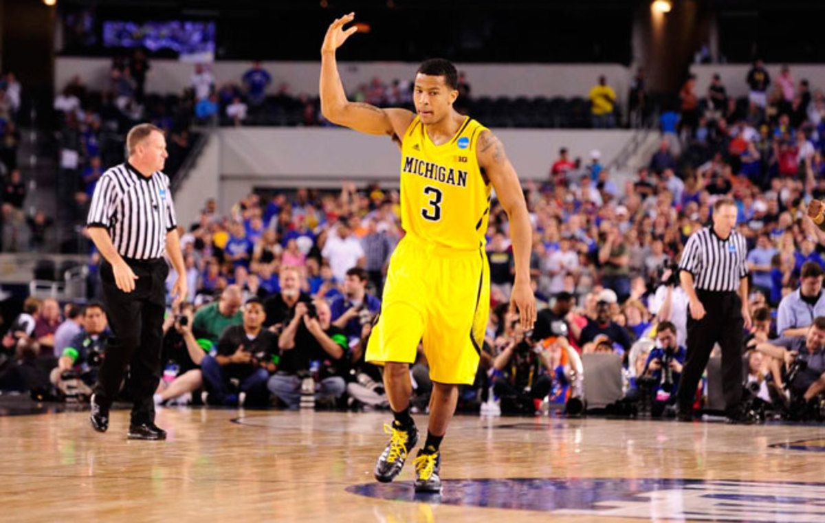 130330014931-trey-burke-three-michigan-win-overtime-kansas-single-image-cut.jpg