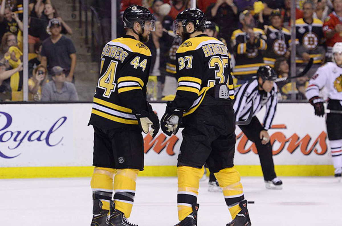 Dennis Seidenberg (left) and Patrice Bergeron couldn't help the Bruins hold off the Blackhawks. 