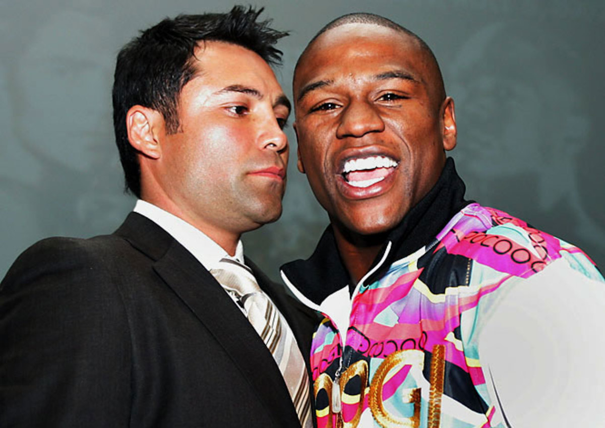 Oscar De La Hoya and Floyd Mayweather Jr.