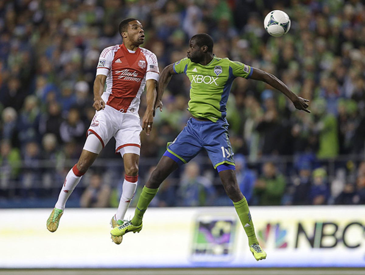 Ryan Johnson (left) scored the opening goal for Portland in the 15th minute. (Ted S. Warren/AP)