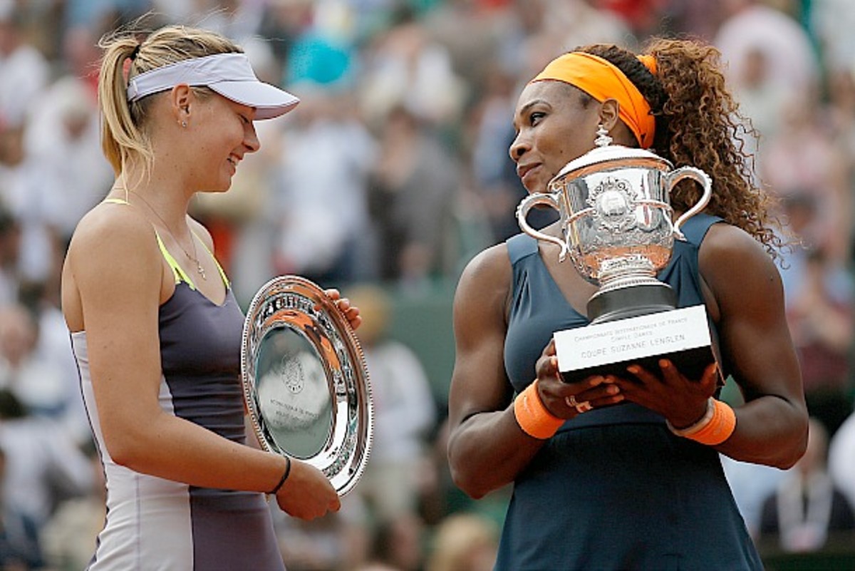 Serena Williams and Maria Sharapova share a smile during the trophy ceremony (Petr David Josek/AP)