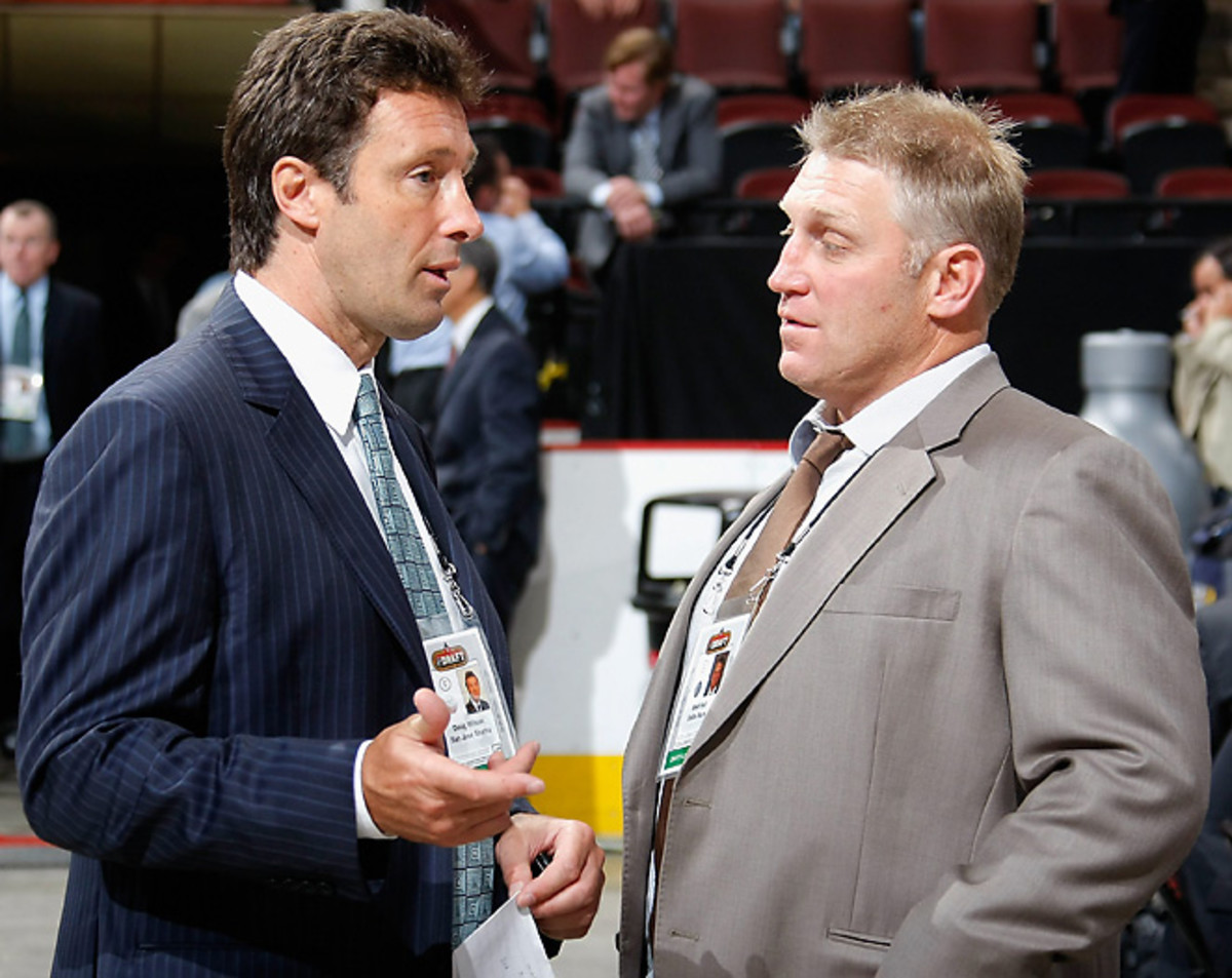 General manager Doug Thomas, seen here speaking to Brett Hull, will continue his day-to-day operations through the Sharks' ownership change.