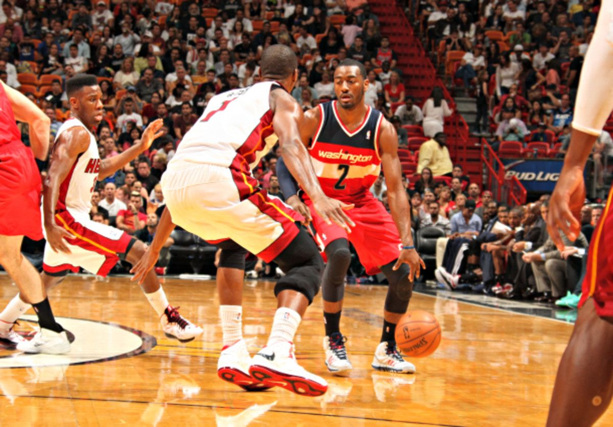 Chris Bosh helps the Heat to contain off-the-dribble threats like the Wizards' John Wall. (Issac Baldizon/NBAE via Getty Images)
