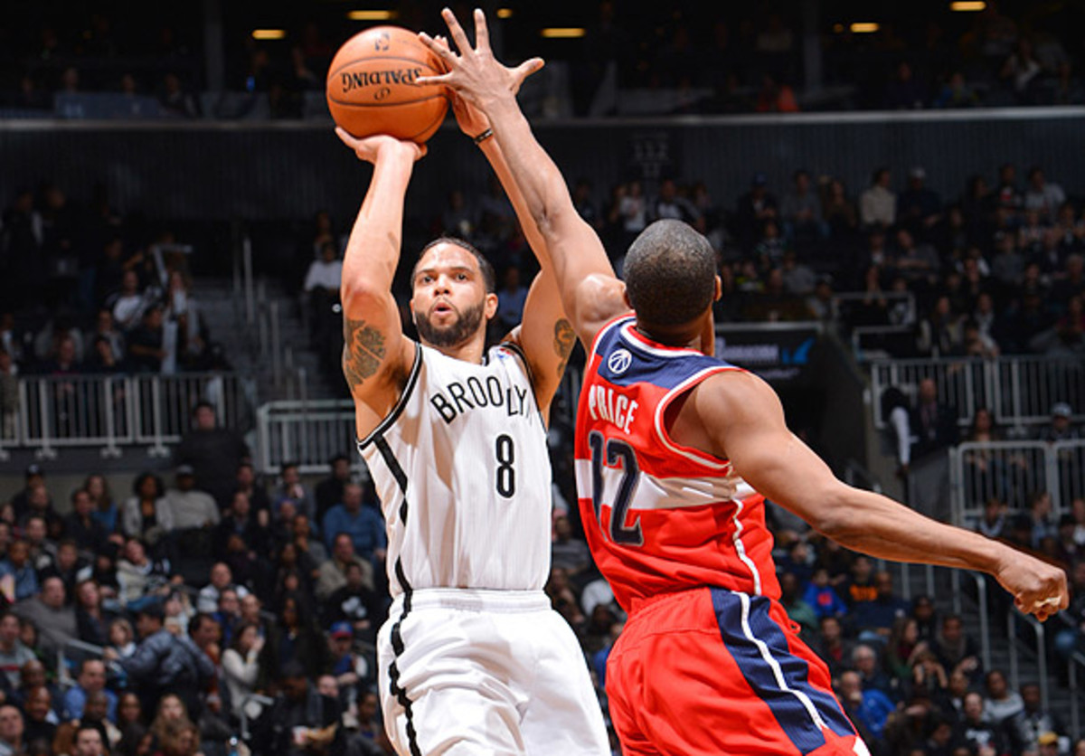 Deron Williams shoots a three-pointer