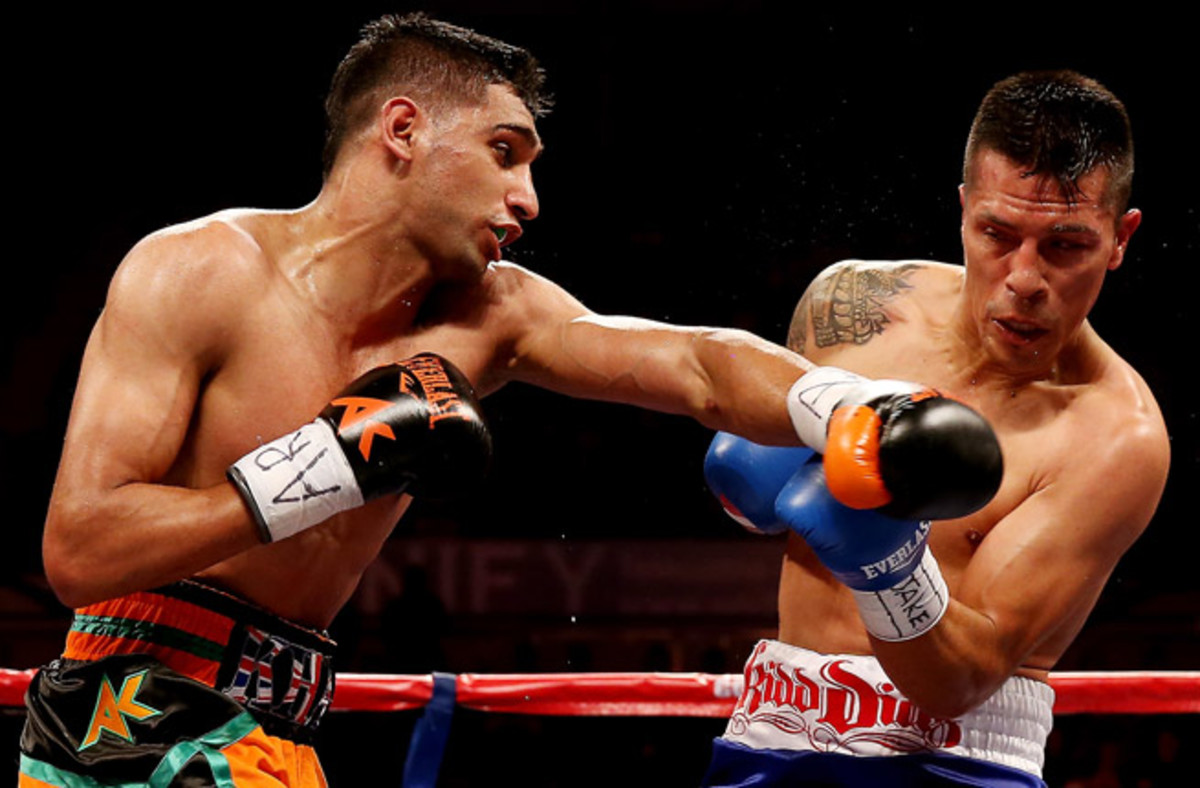 Amir Khan (left) beat Mexico's Julio Diaz in a unanimous 12-round decision in a welterweight bout.