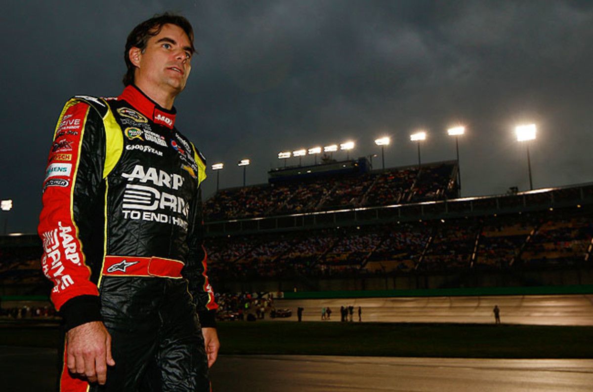 Jeff Gordon looks on as rain forces the circuit's first postponement since last year's Daytona 500.