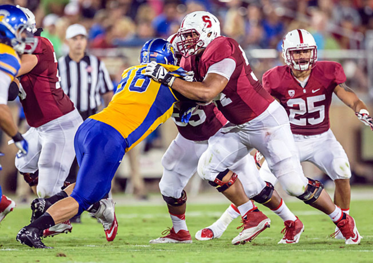David Yankey (54) and Stanford's line anchor an offense that averages 210.9 rushing yards per game.