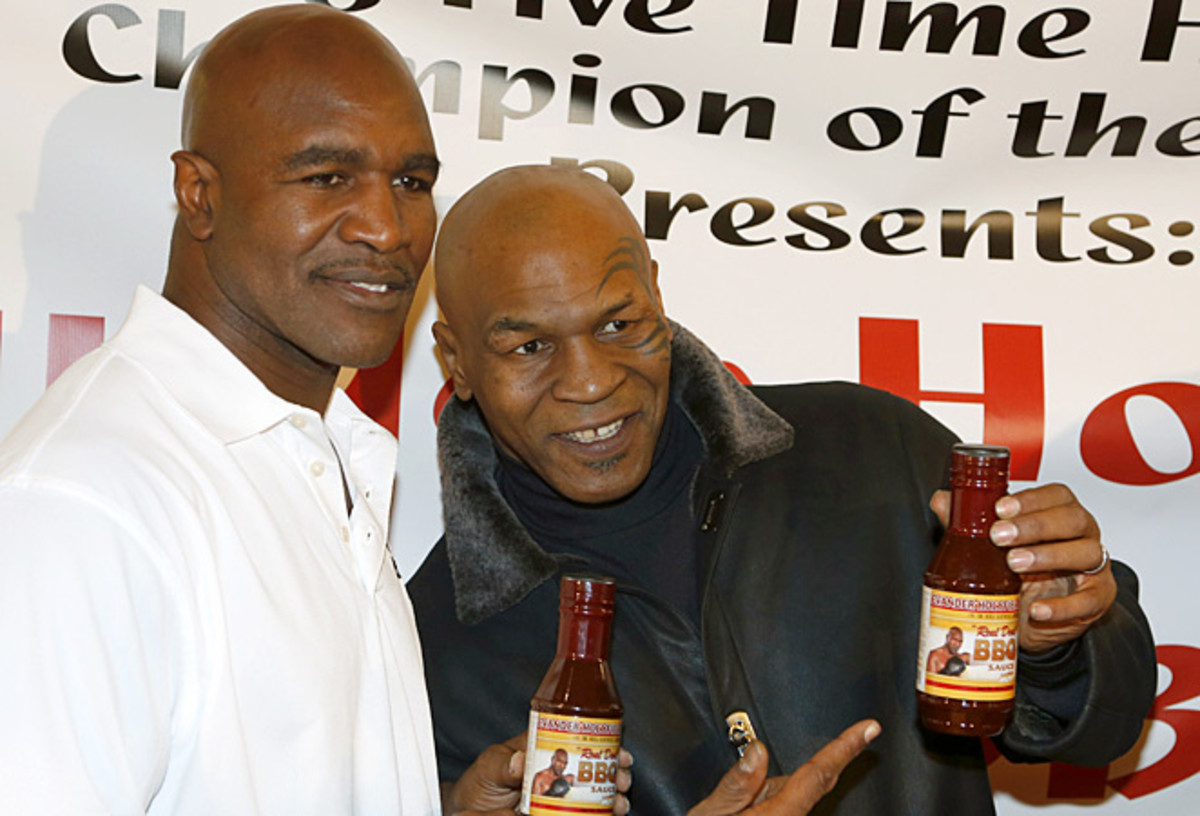 Mike Tyson (right) claims he was embezzled of more than $300,000 and millions more in earnings.