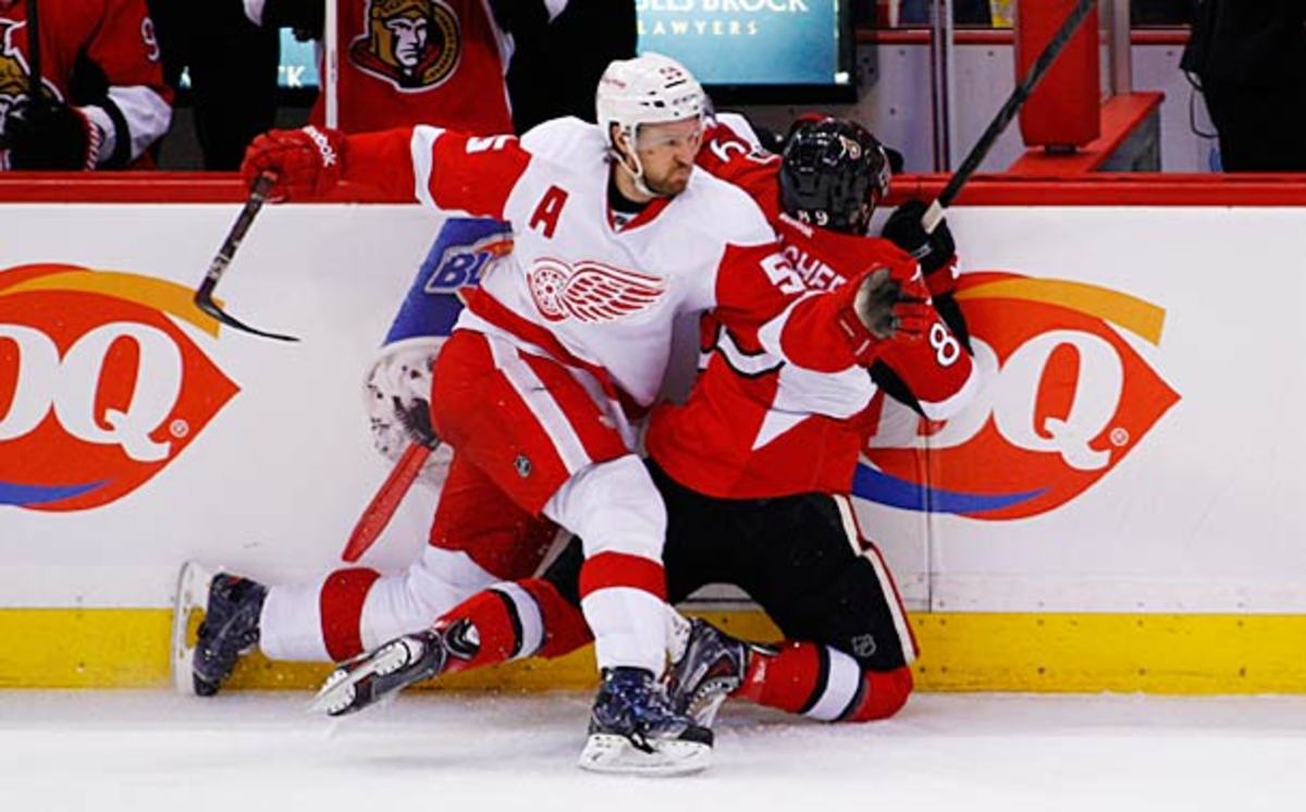 Niklas Kronwall of the Detroit Red Wings Kronwalls Cory Conacher of the Ottawa Senators.