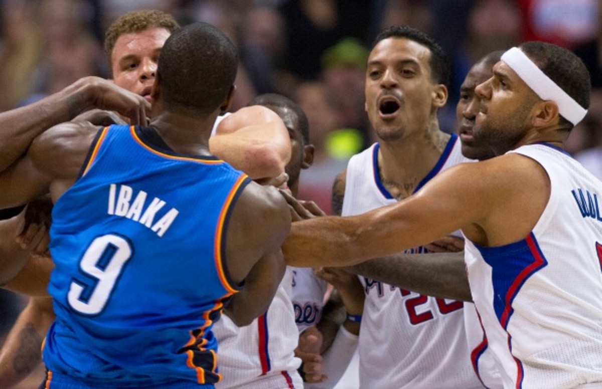 Matt Barnes took his son from the crowd after being ejected. (Robyn Beck/Getty Images)