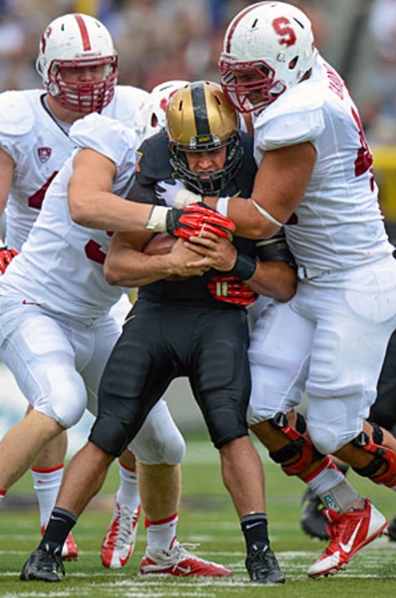 Stanford's Trent Murphy (left) and Ben Gardner teamed up to tackle Army quarterback Angel Santiago during the teams' Sept. 14 matchup.