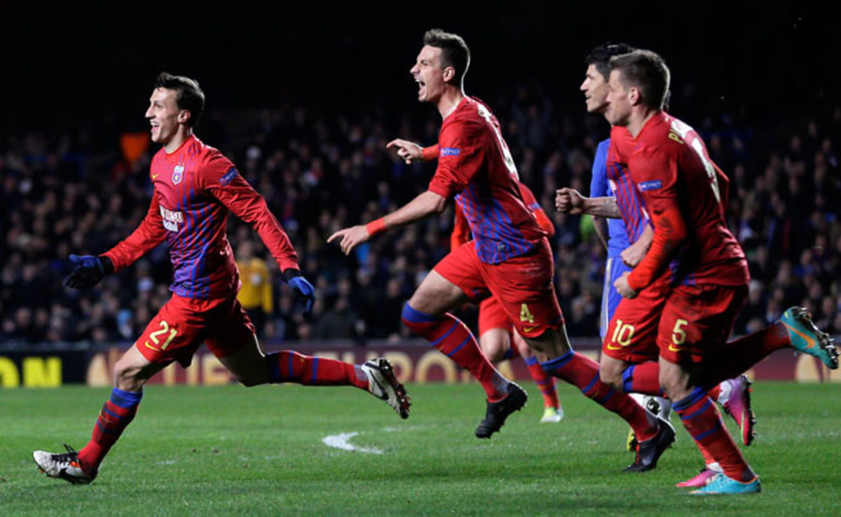 Vlad Chiriches (left) celebrates after scoring a goal against Chelsea in the Europa League.