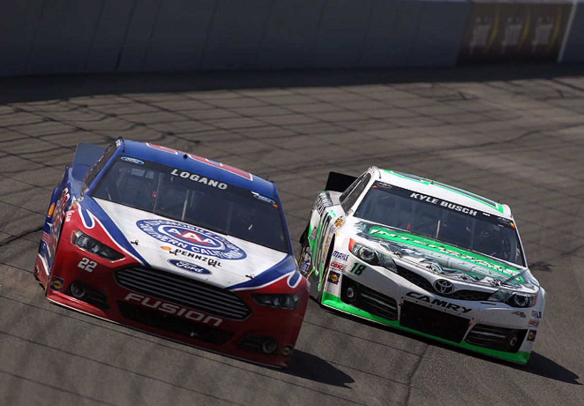 Kyle Busch (right) got his first win at the Auto Club Speedway after holding off Joey Logan and others.