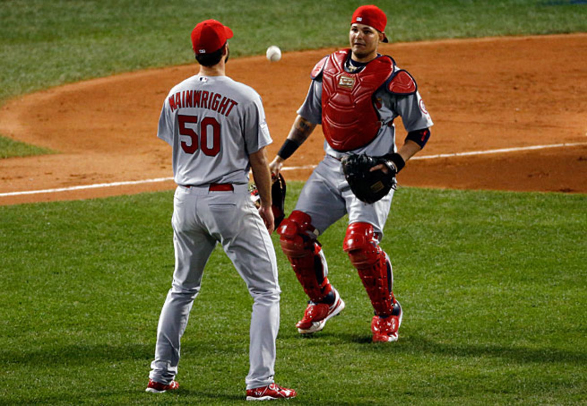 Adam Wainwright and Yadier Molina let a pop up fall, triggering a two-run second inning for Boston.