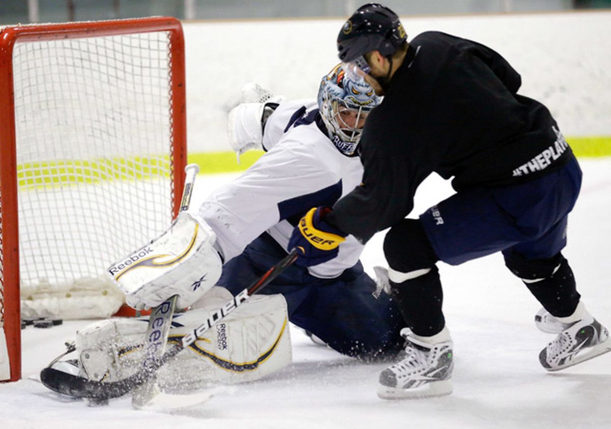 Sabres goaltender Ryan Miller makes a save on a shot by Ville leino during an informal workout.