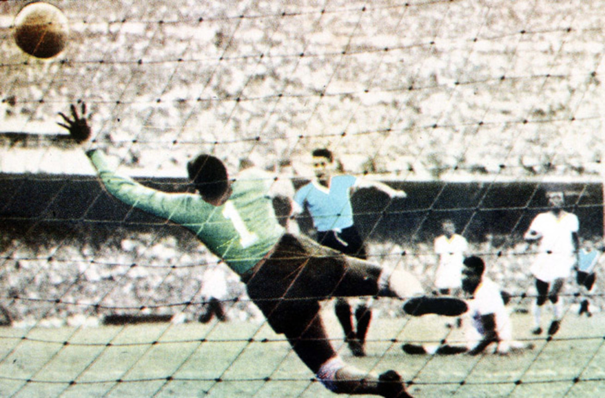 Juan Schiaffino scores Uruguay's first goal past Brazilian keeper Barbosa in the 1950 World Cup final at the Maracana Stadium in Rio de Janeiro. 