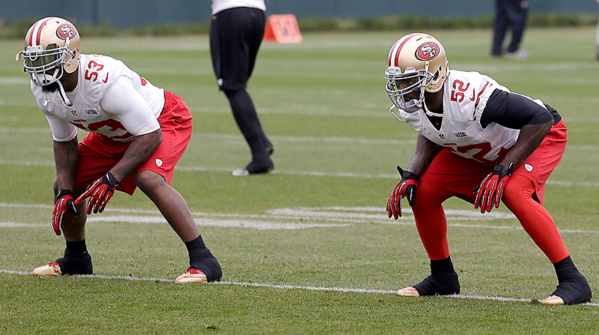 Venture into the middle of the 49ers' defense—right into the arms of NaVorro Bowman (left) and Patrick Willis—at your own peril.