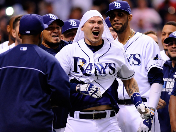 Jose Lobaton (center) saved the Rays with a walkoff homer in the ninth off Boston's Koji Uehara. (Brian Blanco/Getty Images)