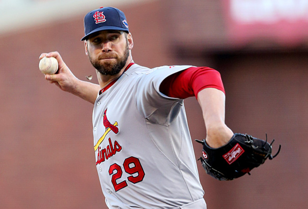 Chris Carpenter threw about 20 pitches to teammates Shane Robinson and Matt Adams on Monday.