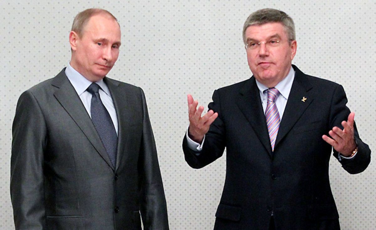 IOC President Thomas Bach (right) says Russian President Vladimir Putin promised him there would be no discrimination against athletes or spectators at the Sochi Olympics.