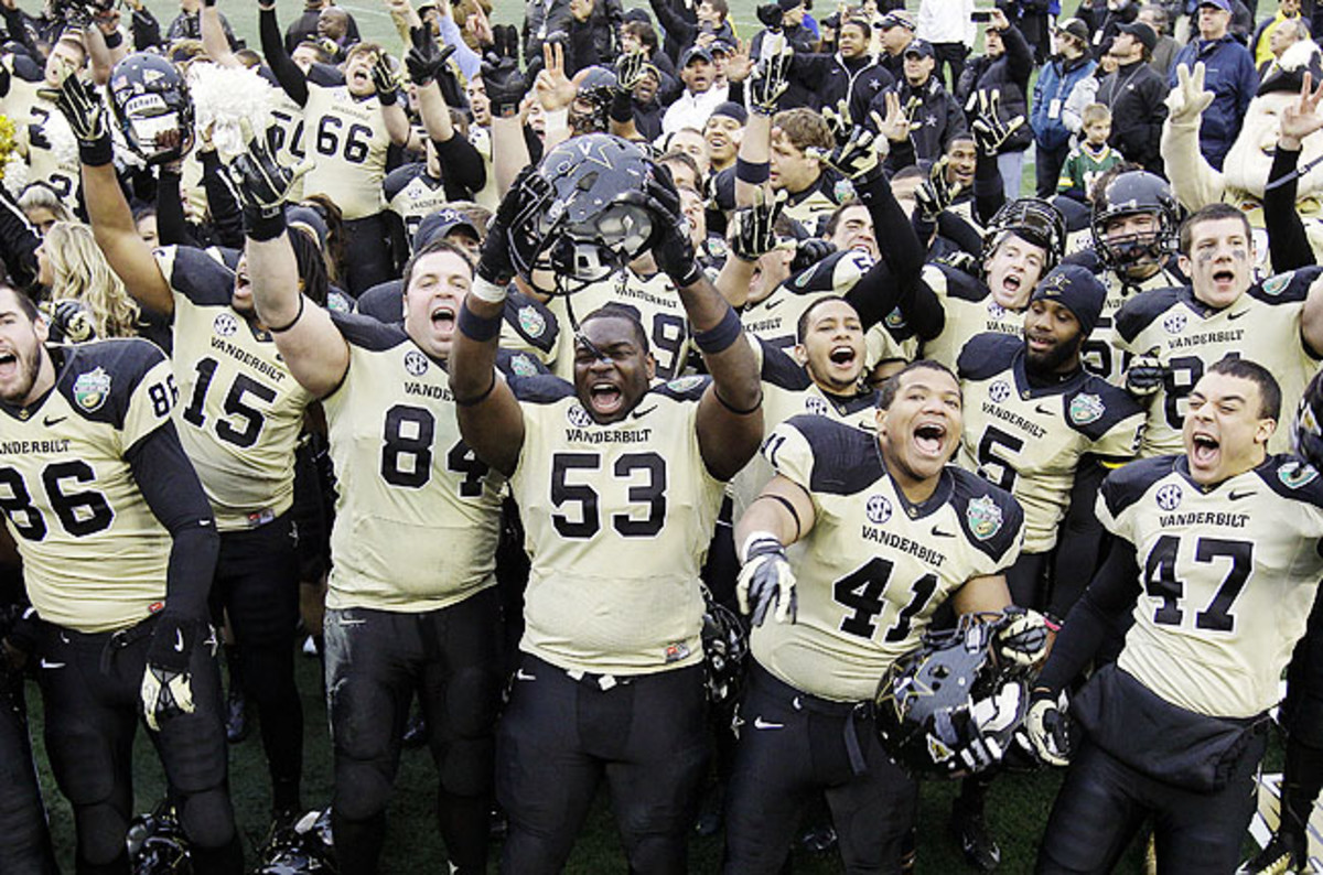 Vanderbilt players celebrated a win against NC State in the Music City Bowl for school's best season since 1915.