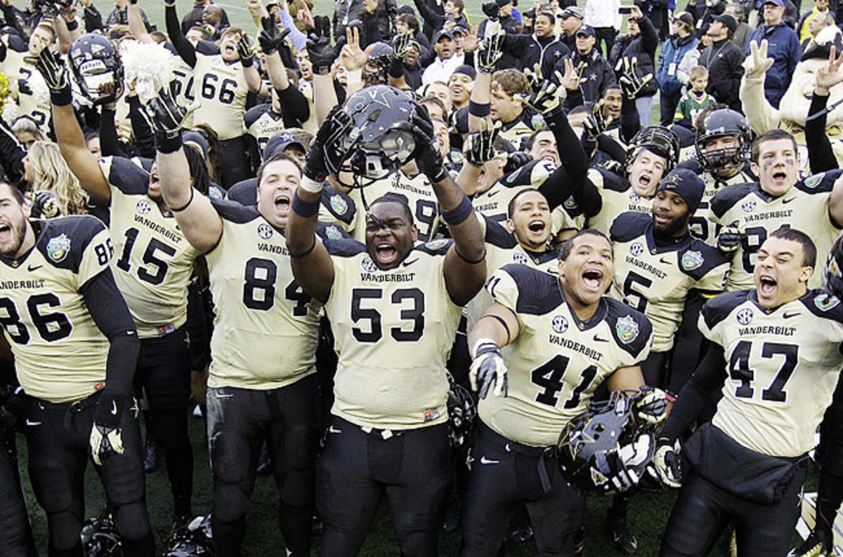 Vanderbilt players celebrated a win against NC State in the Music City Bowl for school's best season since 1915.