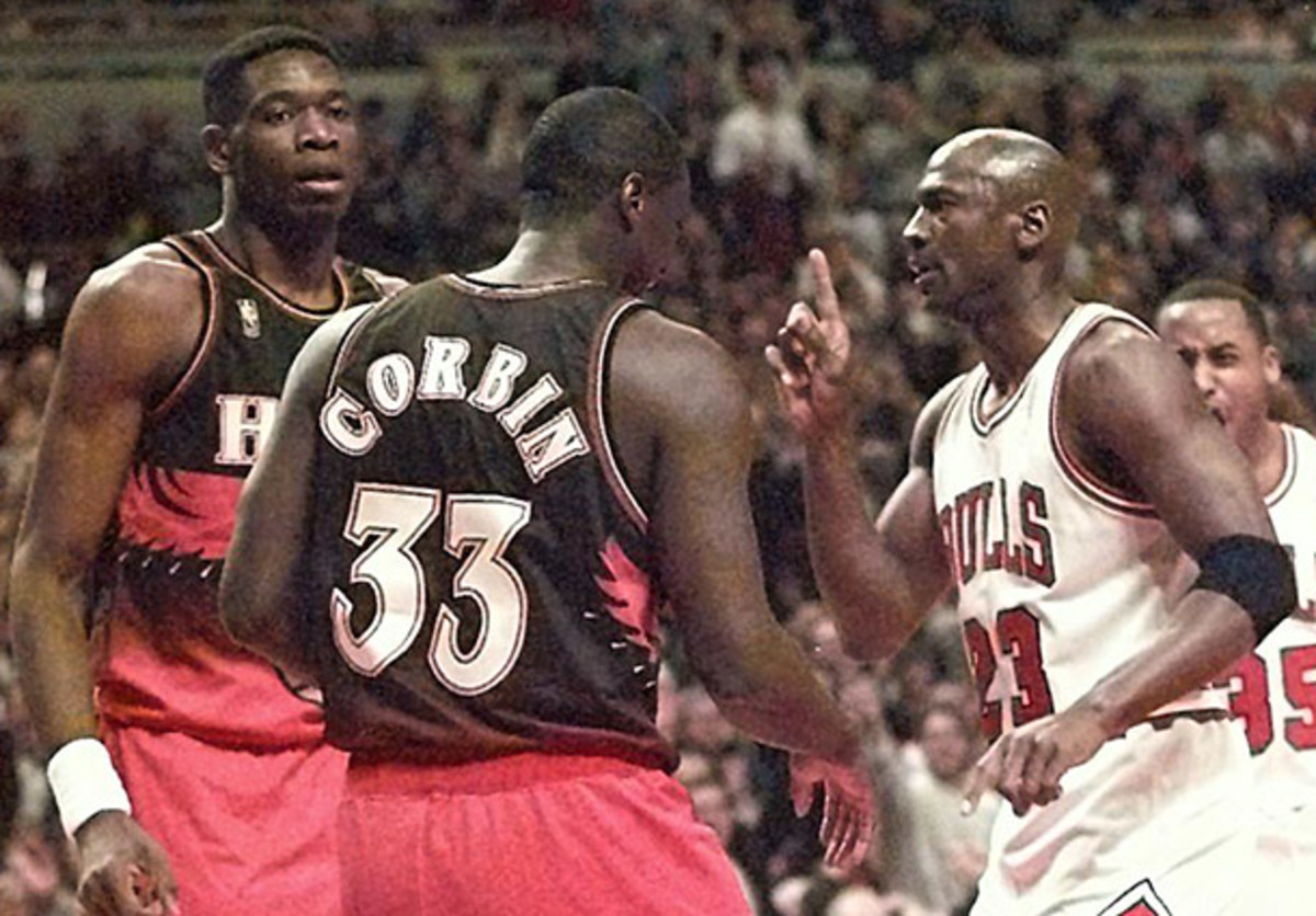 Dikembe Mutombo gets a finger-wag from Michael Jordan