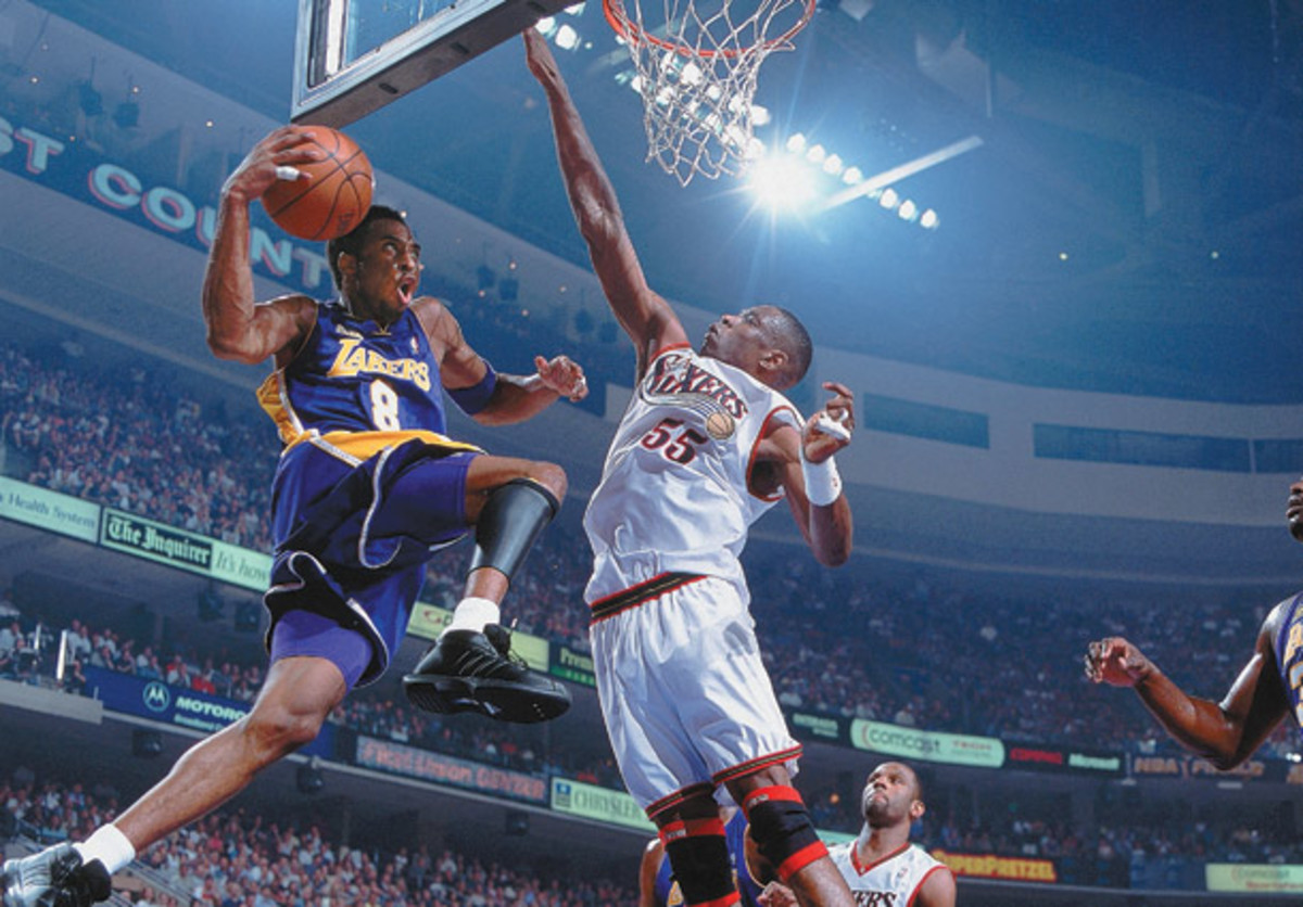 Dikembe Mutombo contests a layup from Kobe Bryant