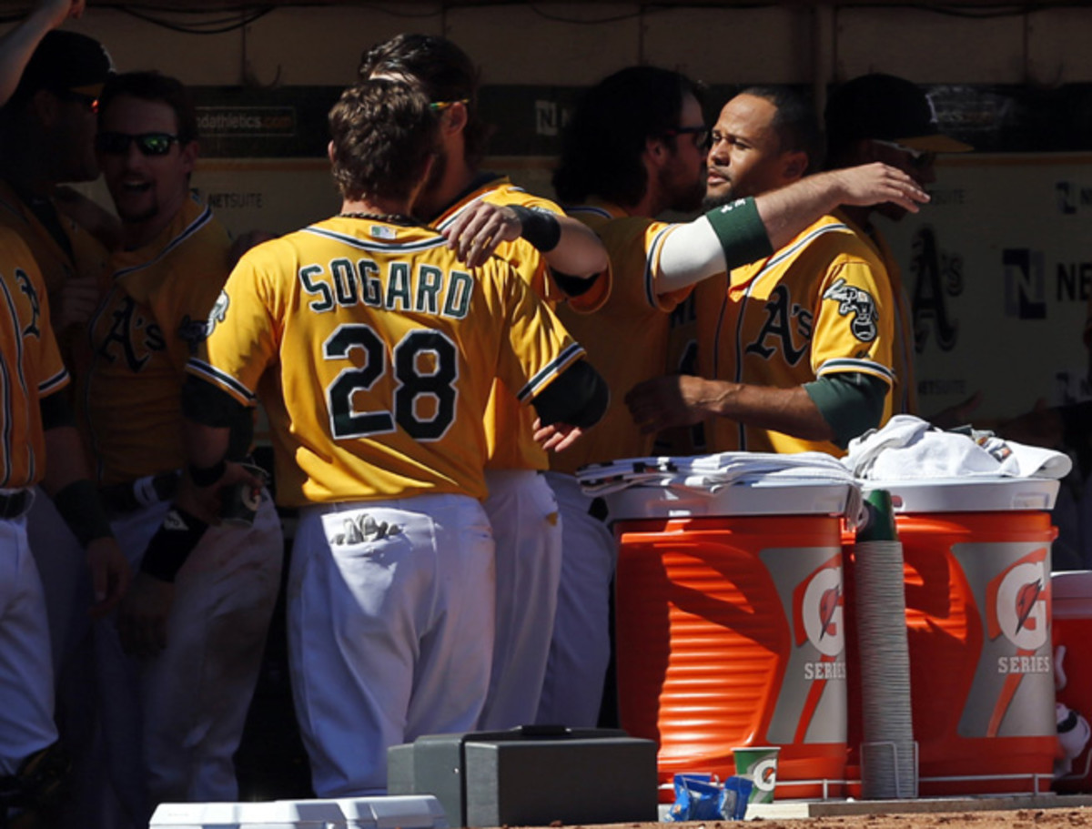 The A's congratulate one another after learning about learning they won the division.