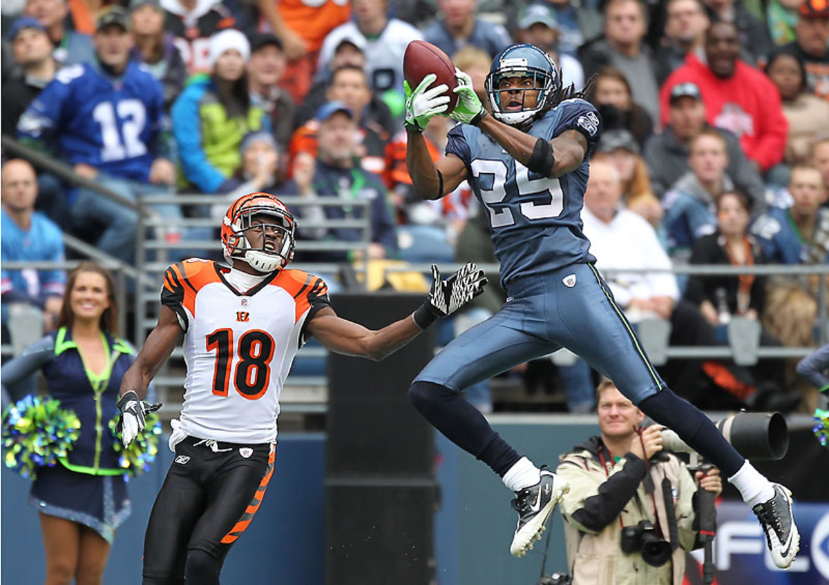 Sherman’s first career interception came in a 2011 game that he played in a fog for two quarters after receiving a blow to the head. (Otto Greule Jr/Getty Images)