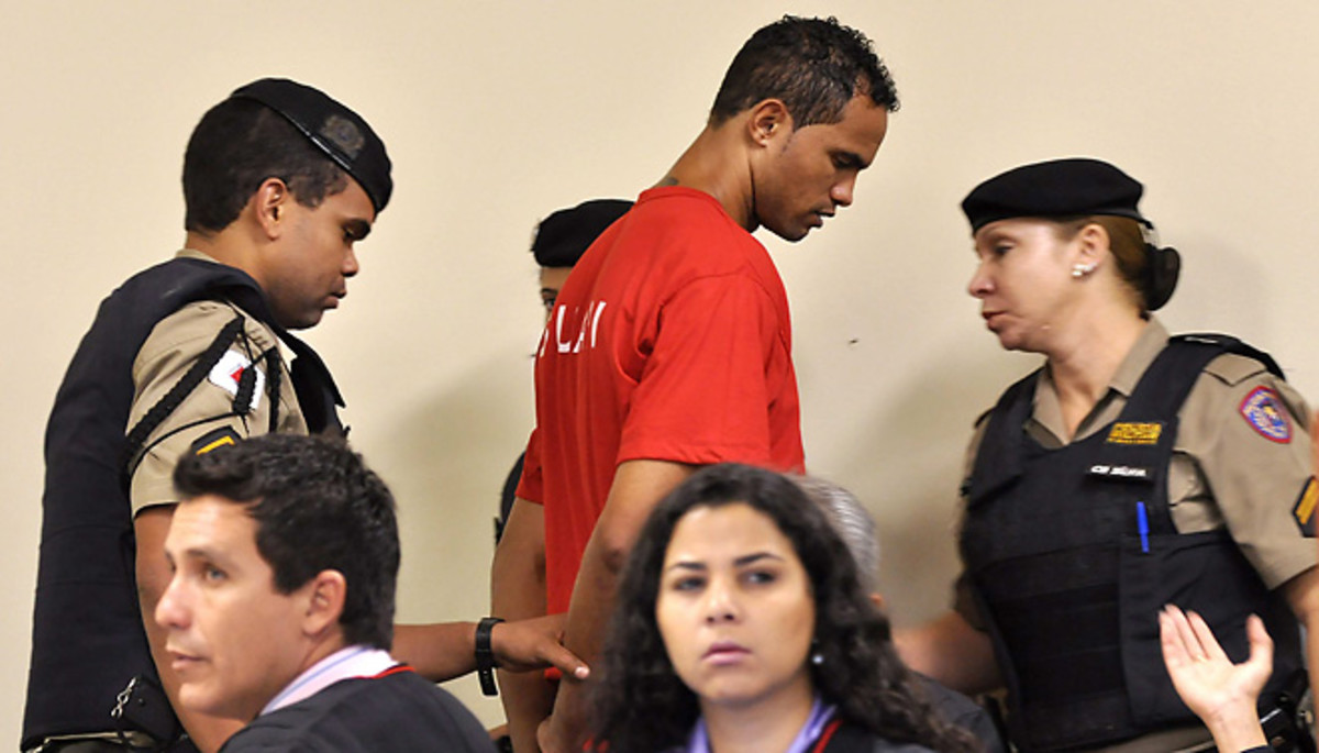 Former Flamingo goalkeeper Bruno is escorted by guards after being handed a 22-year prison sentence.