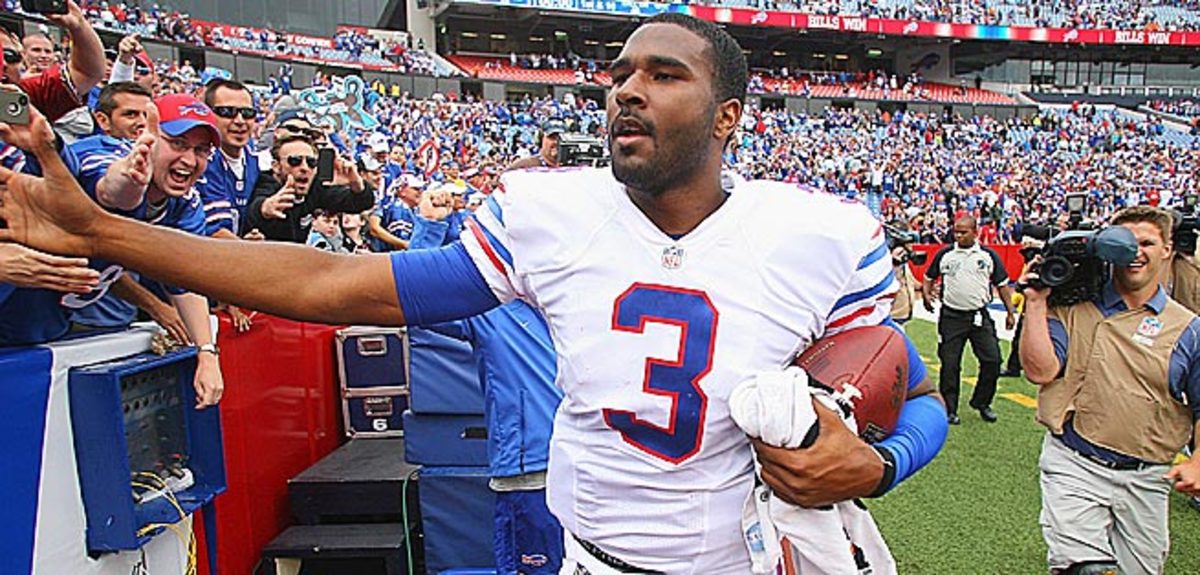 EJ Manuel celebrated his first NFL win with appreciative Bills fans and this proud dad (below, right).