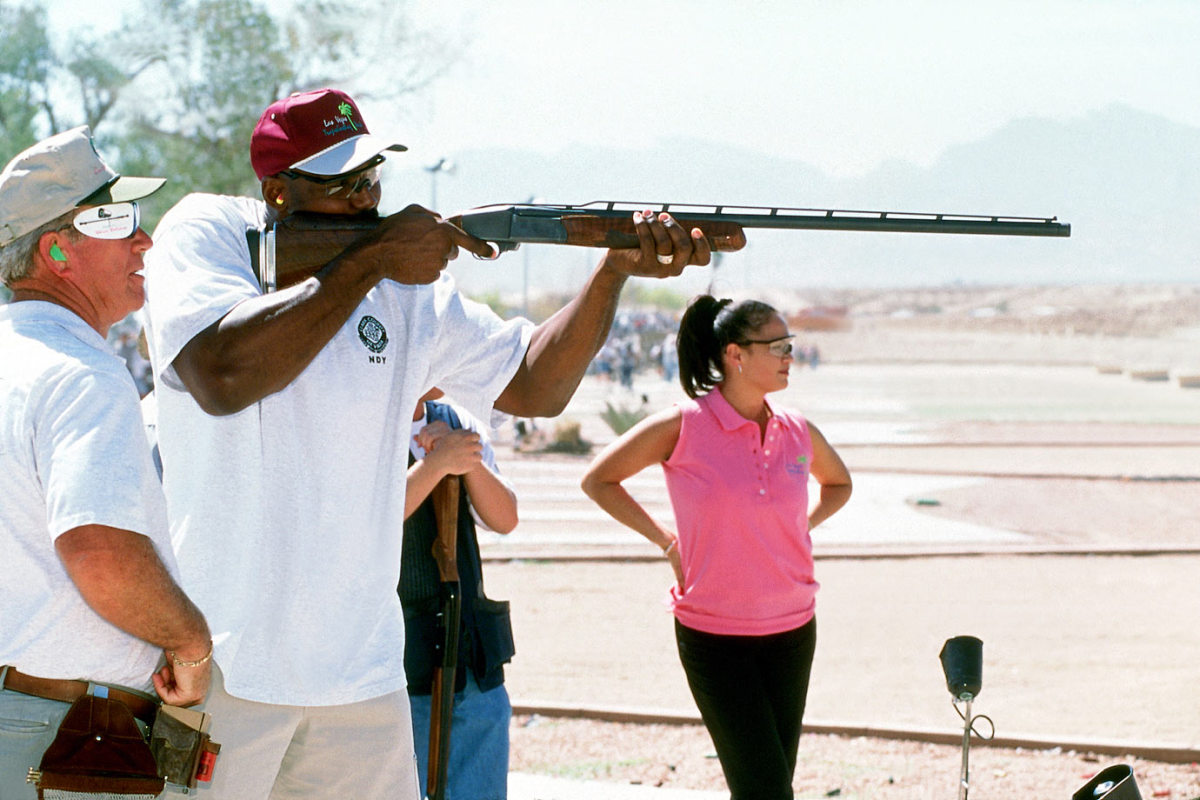 2001-Karl-Malone-shooting-rifle.jpg