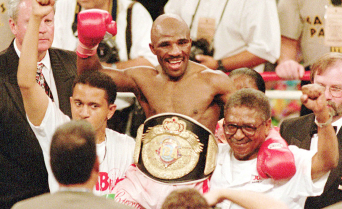 'Baby Jake' Matlala celebrates his 1997 TKO over Michael Carbajal to win the IBA light flyweight belt. Matlala passed away on Saturday at the age of 51.