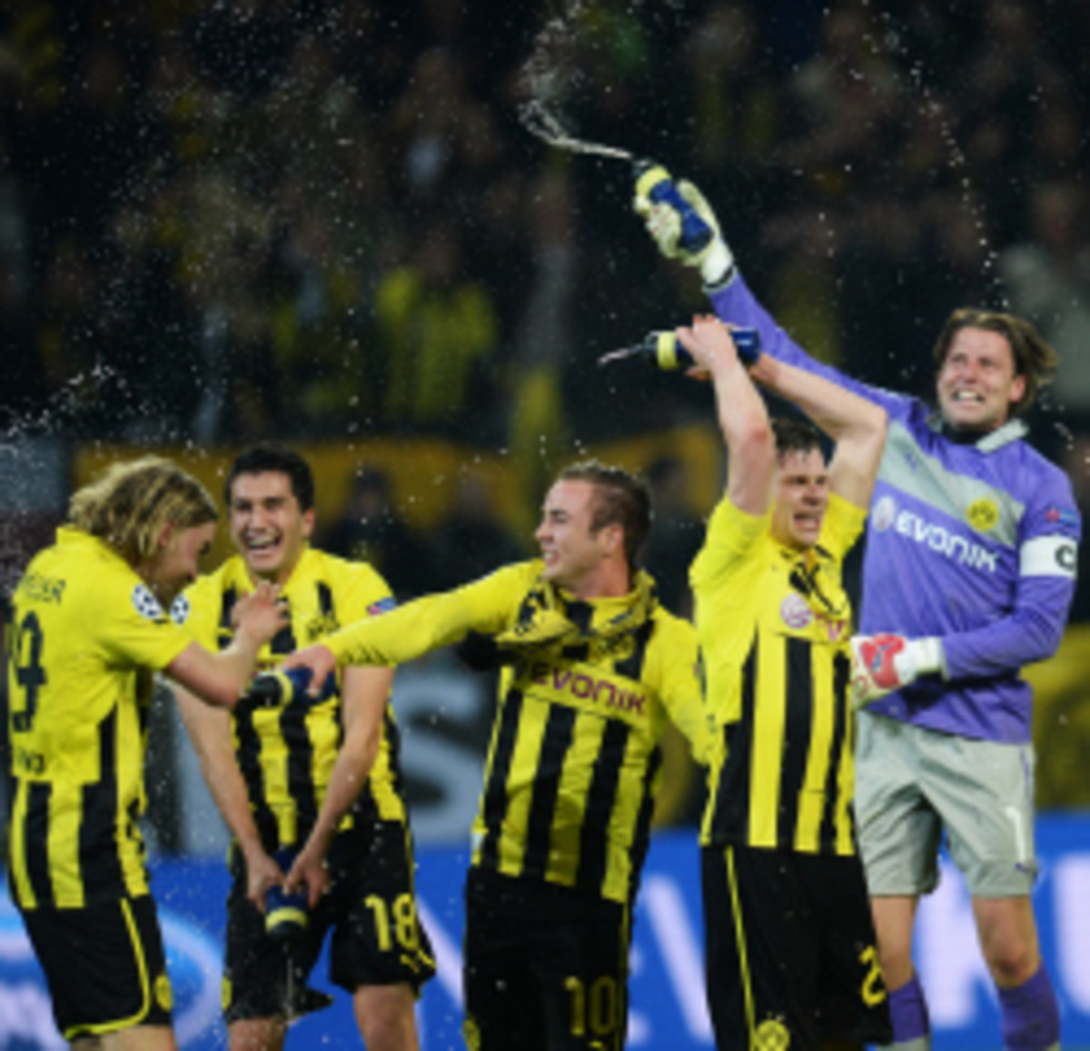 Borussia Dortmund players celebrate a Champions League semifinal match. The team recently announced a new partnership with Turkish Airlines. (Patrik Stollarz/Getty Images)