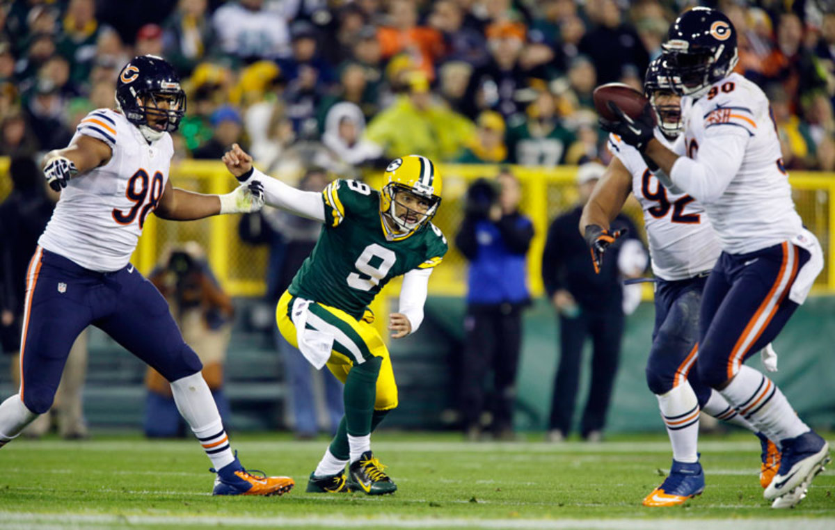 After replacing Aaron Rodgers against the Bears last Monday night, Seneca Wallace completed 11 of 19 passes for 114 yards and no touchdowns. He was sacked four times for 25 yards and threw this interception to Julius Peppers in the first quarter. (Jeffrey Phelps/AP)