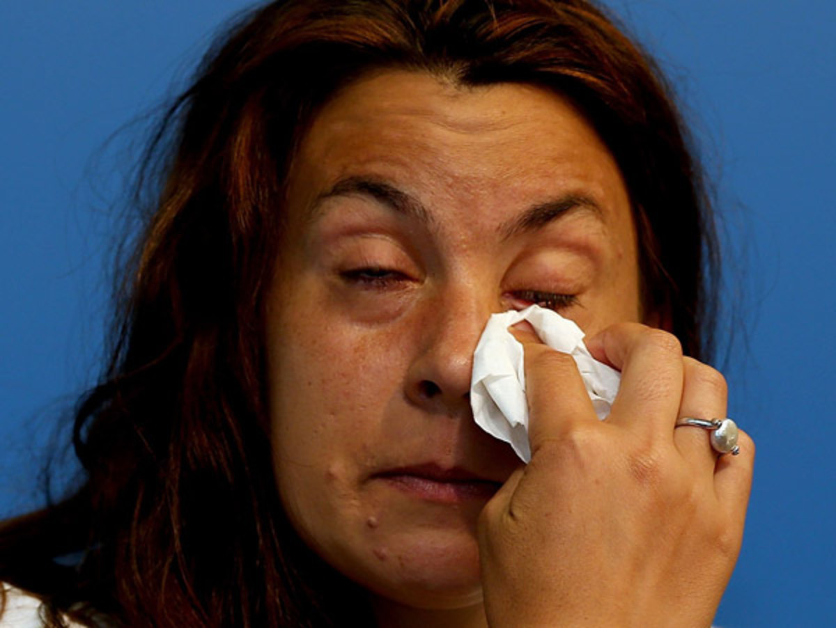Marion Bartoli wipes away tears after announcing her retirement Wednesday. (Matthew Stockman/Getty Images)