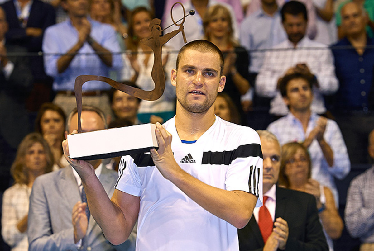 Mikhail Youzhny claimed his second title of the year by taking down the No. 1-seeded David Ferrer.