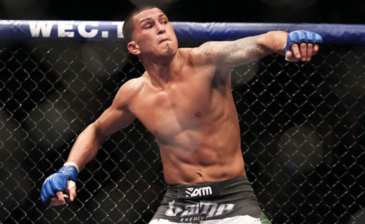 Anthony Pettis celebrates after defeating Benson Henderson in their 2010 WEC bout.