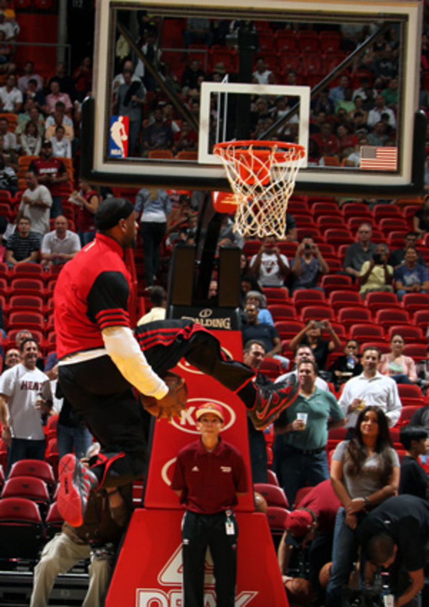 LeBron James dunks through his legs with ease. (Issac Baldizon/Getty Images)