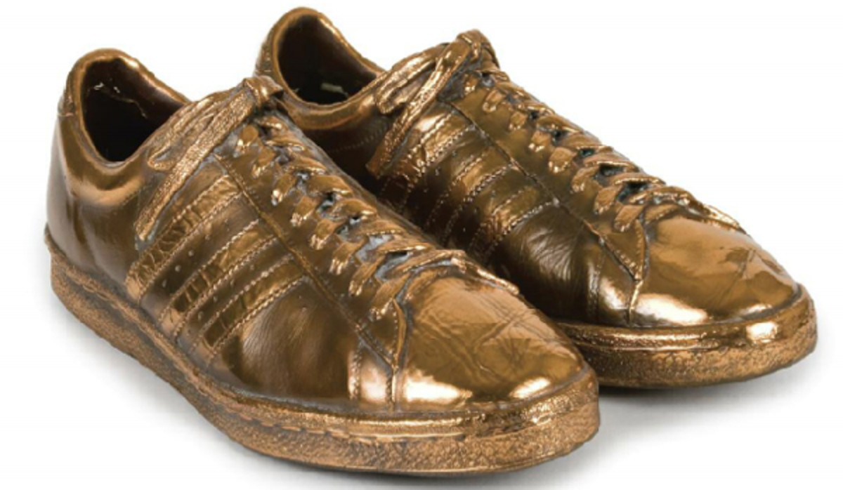 Bronzed game-worn shoes given to Baylor by Merv Griffin as a retirement gift. (JuliensAuctions.com)
