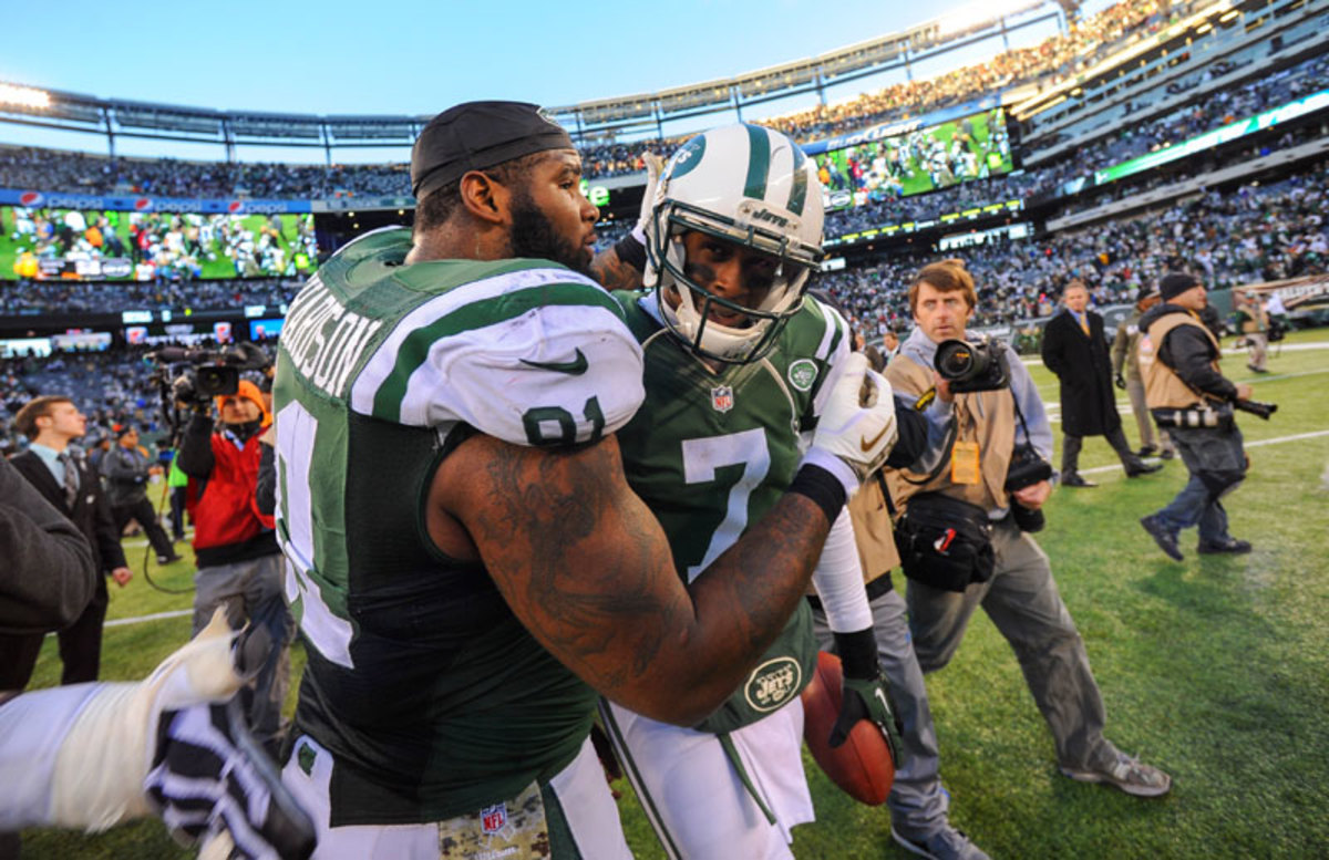 Defensive tackle Sheldon Richardson, a fellow rookie who called the Jets "elite" on Sunday, embraced first-year quarterback Geno Smith following the Jets' shocking 26-20 win over the Saints. (Ron Antonelli/Getty Images)