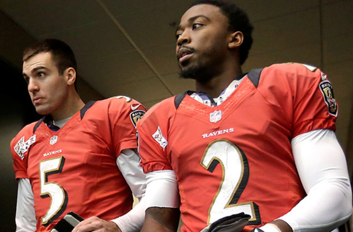 Joe Flacco (left) is the Ravens' starting quarterback, but Tyrod Taylor is playing an important role too. (Patrick Semansky/AP)