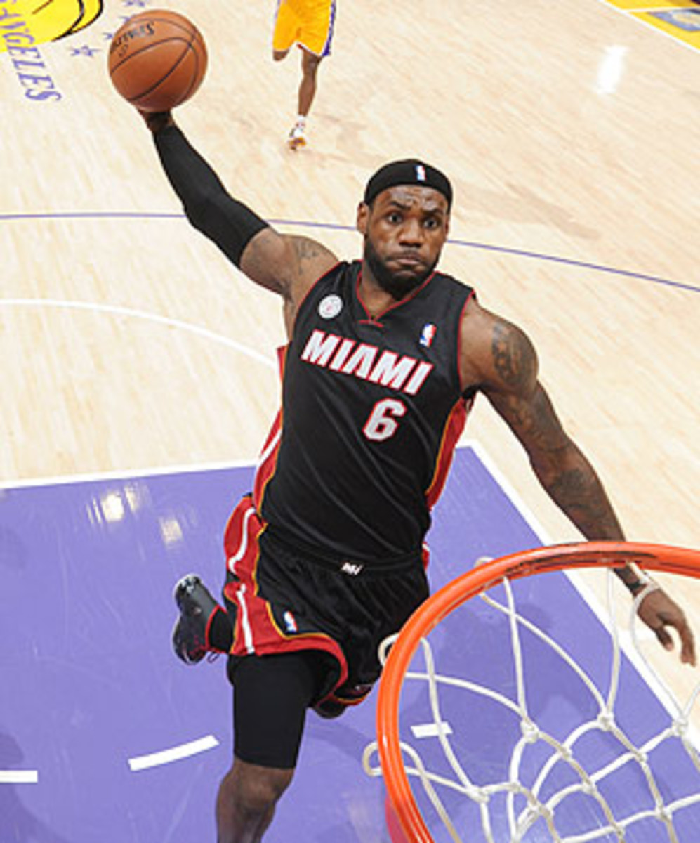 LeBron James dunks against the Lakers