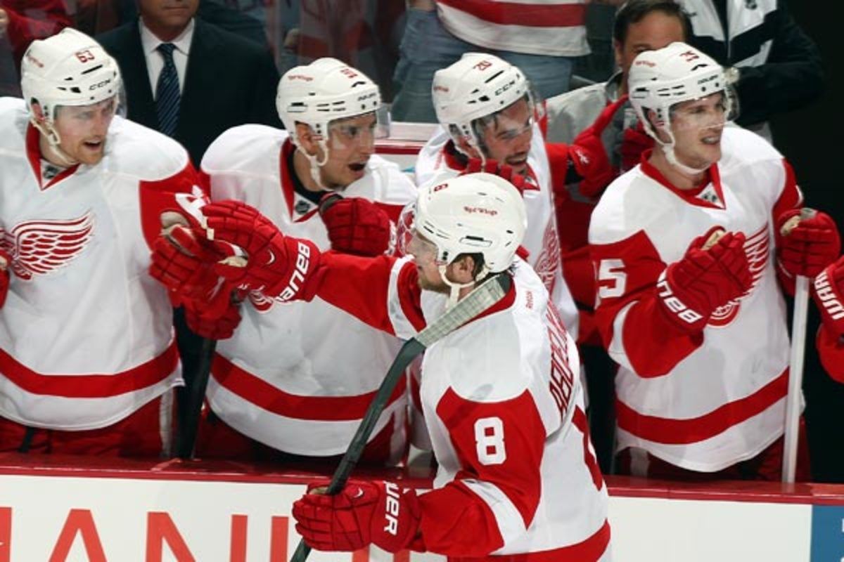 Justin Abdelkader is congratulated after completing his hat trick vs. the Ducks. (Debora Robinson/Getty Images)