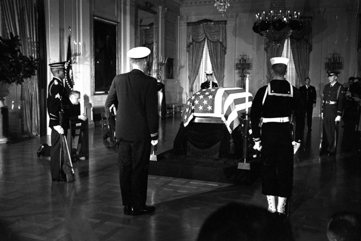 While players prepared for Sunday, the late president lay in state in the Capitol rotunda. (AP)